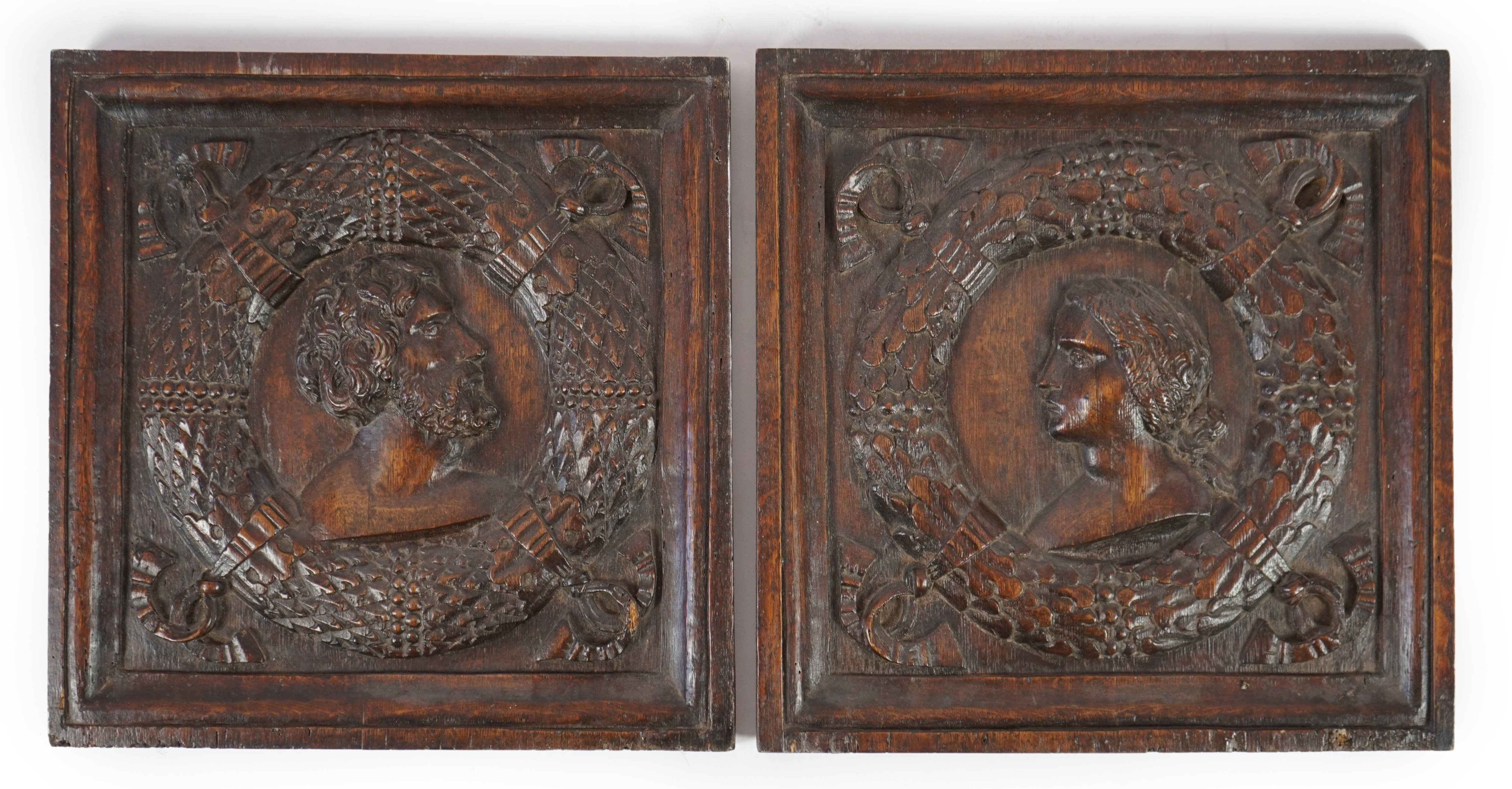 A pair of 17th century carved oak panels